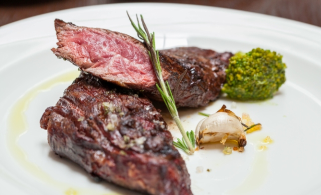 Hanging tender with sautéed broccoli at Bistecca Tuscan Steakhouse