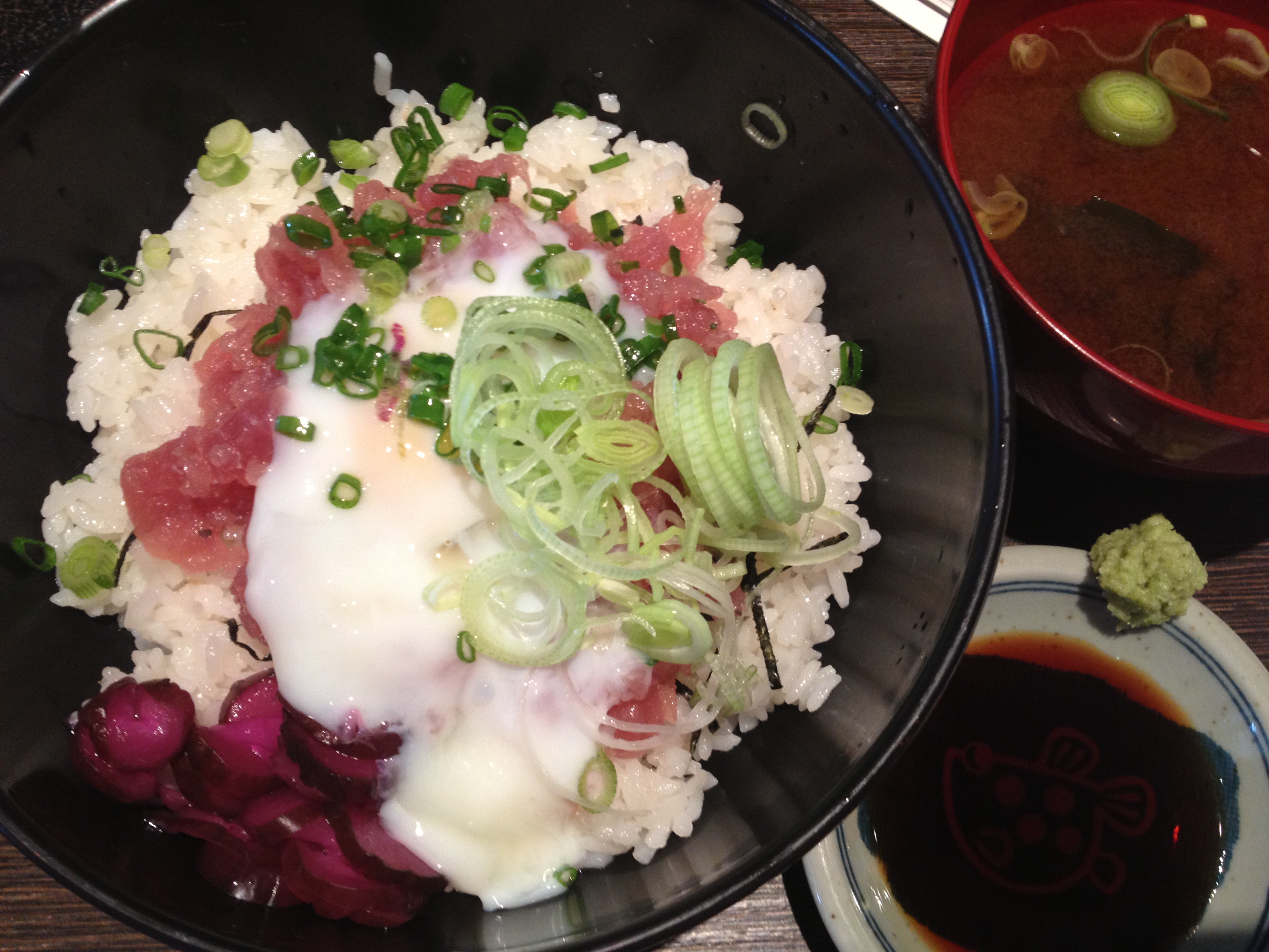Katanashi sushi rice topped with raw tuna, shallot, soft-boiled egg.